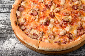 Pizza, hot pizza on a white wooden background, side and top view