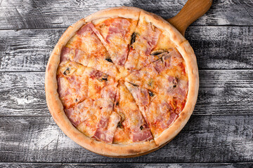 Pizza, hot pizza on a white wooden background, side and top view