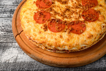 Pizza, hot pizza on a white wooden background, side and top view