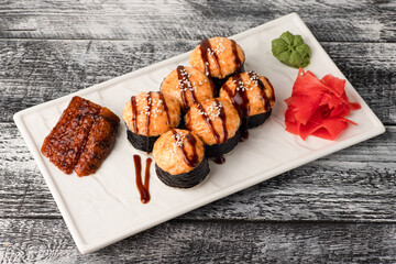 Rolls, sushi, sushi with fish on a wooden white background