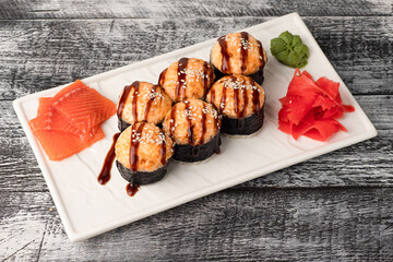 Rolls, sushi, sushi with fish on a wooden white background
