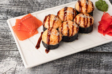 Rolls, sushi, sushi with fish on a wooden white background