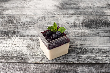 panna cotta, panna cotta dessert takeaway, white wooden background
