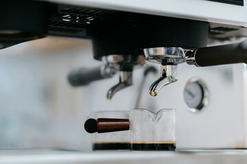 Close-up shot of the bottom of the coffee machine when finished brewing