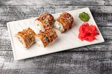 Rolls, sushi, sushi with fish on a wooden white background