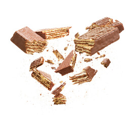 Chocolate wafers are broken into pieces isolated on a white background
