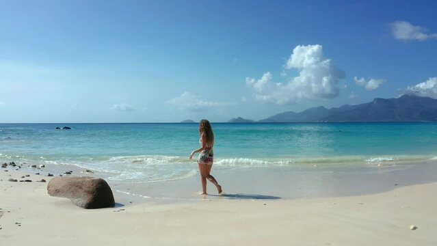 Girl on beach in Mahe Island Seychelles, Anse Petite