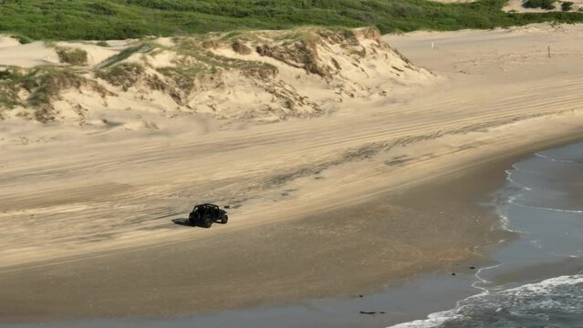 4x4 jeep wrangler driving on beach sand Corolla North Carolina