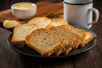 Healthy wholemeal toast with butter and coffee.