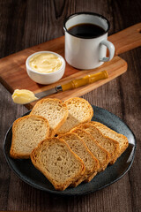 Healthy wholemeal toast with butter and coffee.