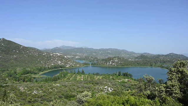 View on blue lake between green hills in nature. Bacinska jezera, Ploce, Craotia. Panoramic view of Baćina lakes.
