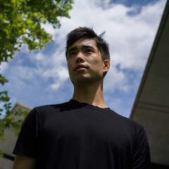 Portrait of a young man outside