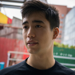 Portrait of a young man outside