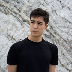 Portrait of a young man outside