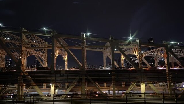 View From Roosevelt Island Tram At Night. Queensboro Bridge Aerial View In Manhattan