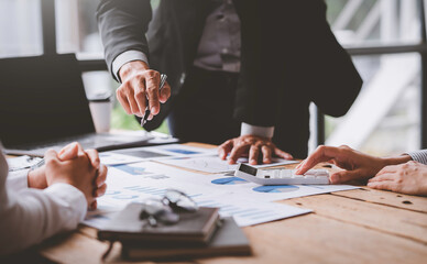 Startup business team meeting working on ..graph document and laptop new business project, Group of Business People Diverse Brainstorm Meeting Concept