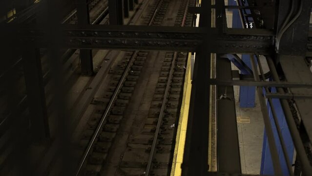 Top Down View Of 2 Train Passing 14th Street Station In Manhattan. MTA Train From Above