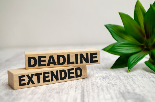 two wooden blocks with the words dEADLINE EXTENDED