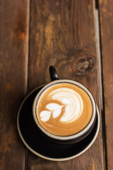 Isolated cup of cappuccino on a table 