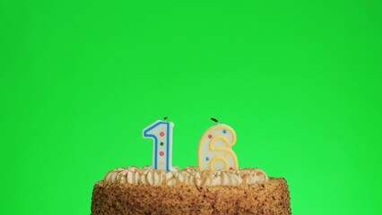 Cake with lighted candle number 16. Green screen background. Isolated.