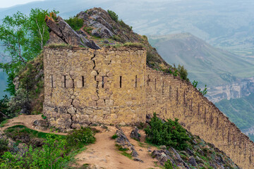 ancient tower on top of a sheer cliff in a mountainous area, Gunib (Shamil) fortress in Dagestan