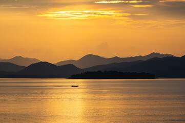 view of sunset over lake in Thailand