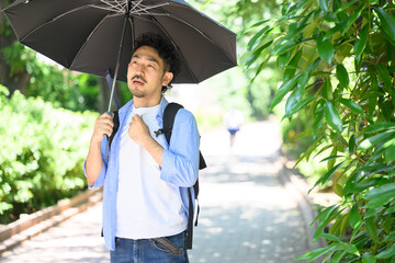 Man Wearing a Parasol
