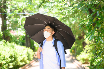 Man using parasol Mask - obrazy, fototapety, plakaty