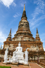 Fototapeta premium The Buddha and his disciple statue in Wat Yai Chai Mongkhon , a Buddhist temple in Ayutthaya Thailand. The monastery was constructed by King U-Thong in 1357 AD. 