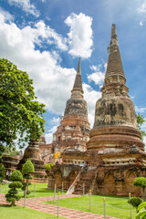Fototapeta premium Ayutthaya Thailand 5th Jun 2022: The Prang of Wat Yai Chai Mongkhon , a Buddhist temple. The monastery was constructed by King U-Thong in 1357 AD. 