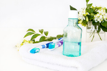 Obraz na płótnie Canvas toothbrush, mouthwash health care for oral cavity arrangement flat lay style on background white 