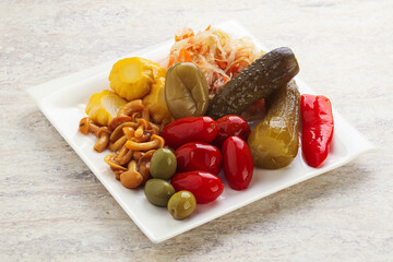 Plate with pickled vegetables and mushrooms