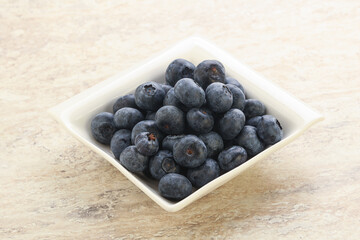 Sweet ripe blueberry heap in the bowl