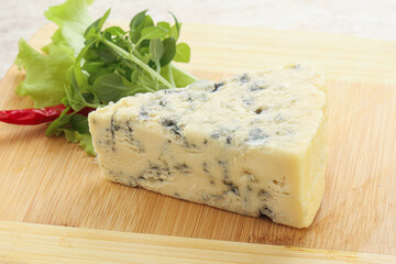 Blue cheese piece over board