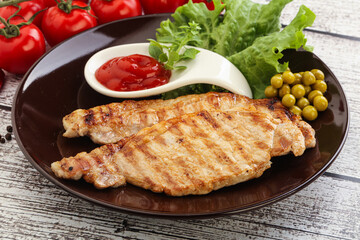 Grilled pork steak with ketchup
