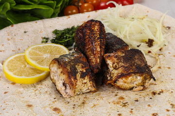 Baked scomber fish served onion