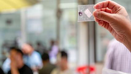 Chanthaburi gemstone market. People selling gemstones. Blurred image.