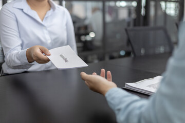 Employee submits the resignation letter envelope to the head of personnel, Carrying a box of work...