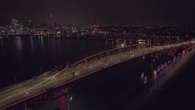 Auckland harbour bridge lit up at night, New Zealand
