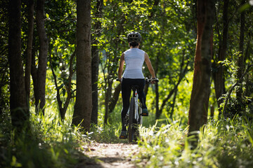 Mountain biking in summer forest