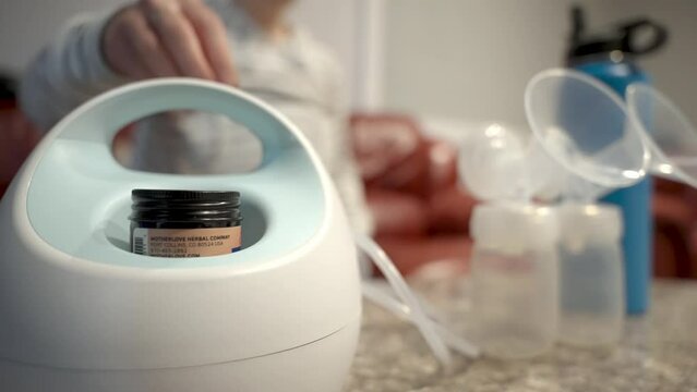 Cleaning and setting up breast pump.