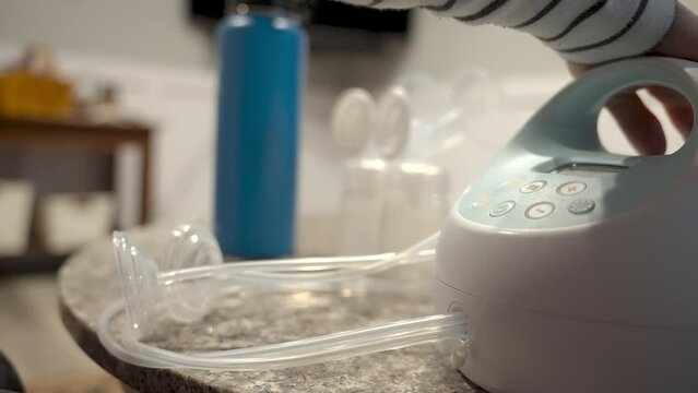 Cleaning and setting up breast pump.