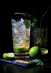 Two mojitos on a black background