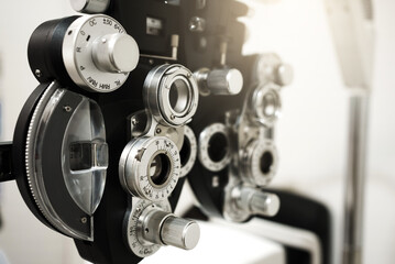 Close up of phoropter eyesight measurement testing machine, Eye health check and ophthalmology concept. - obrazy, fototapety, plakaty