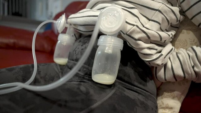 woman using breast pump