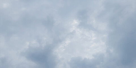 Fototapeta premium Abstract dark cloudy sky background with clouds cape, Fresh and clear blue sky background with fluffy and blurry clouds, Natural blurry and cloudy sky with watercolor shades.