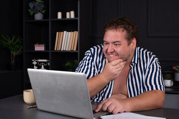 A man watches an adult video online.