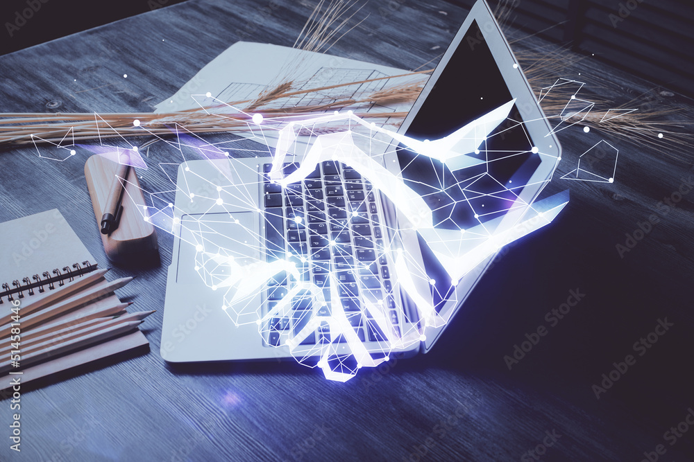 Poster desktop computer background in office and handshake hologram drawing. double exposure. pertnership c