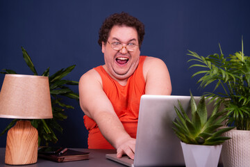 A man watches an adult video online.