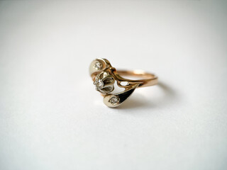 Gold diamond ring on a white isolated background. Red Gold Ring